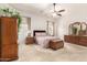Serene primary bedroom with neutral walls, carpet flooring, and stylish furniture at 11242 E Onza Ave, Mesa, AZ 85212