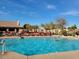 Community pool offers lounge chairs and tables for residents, and a clean area for swimming at 11242 E Onza Ave, Mesa, AZ 85212