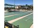 A community shuffleboard area featuring multiple courts for engaging outdoor recreation at 11242 E Onza Ave, Mesa, AZ 85212