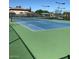 Well-maintained tennis court, perfect for recreation and exercise in a vibrant community setting at 11242 E Onza Ave, Mesa, AZ 85212