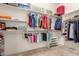 Organized walk-in closet with shelves and hanging rods maximizing storage space at 11242 E Onza Ave, Mesa, AZ 85212
