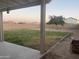 A large backyard with a covered patio, perfect for outdoor entertaining at 12501 W Rosewood Dr, El Mirage, AZ 85335