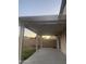 A covered patio with string lights and a backyard view provides an entertainment space at 12501 W Rosewood Dr, El Mirage, AZ 85335