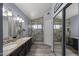 Bathroom featuring double sinks, granite countertops, and a separate glass-enclosed shower at 13593 N 91St Way, Scottsdale, AZ 85260