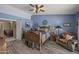 Rustic-style bedroom with hardwood floors, Western decor, and comfortable furnishings at 13593 N 91St Way, Scottsdale, AZ 85260