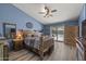Comfortable bedroom with a ceiling fan and sliding glass doors to the pool area at 13593 N 91St Way, Scottsdale, AZ 85260