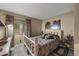Bedroom features rustic furnishings, patterned curtains, and a soft color palette at 13593 N 91St Way, Scottsdale, AZ 85260