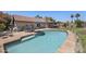 Backyard pool with shallow steps, a sunbathing patio, desert landscaping, outdoor living area, and mature shade trees at 13593 N 91St Way, Scottsdale, AZ 85260