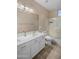 Bathroom features a dual sink vanity with ample counter space and a shower and tub combo at 1398 W Windhaven Ave, Gilbert, AZ 85233