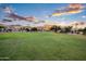 Expansive green community space offers a serene environment with mature trees and manicured lawns at 1398 W Windhaven Ave, Gilbert, AZ 85233