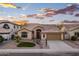 Charming single-story home with a tile roof and low-maintenance desert landscaping against a beautiful sunset sky at 1398 W Windhaven Ave, Gilbert, AZ 85233