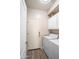 Convenient laundry room featuring white cabinets, washer, dryer, and exterior door at 1398 W Windhaven Ave, Gilbert, AZ 85233