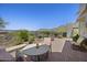 Cozy backyard with seating, pavers, fire pit, mountain view and manicured foliage at 14007 E Lupine Ave, Scottsdale, AZ 85259