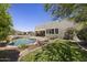 A luxurious pool and spa with beautiful landscaping and desert views at 14007 E Lupine Ave, Scottsdale, AZ 85259