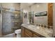 Bathroom with a sink, toilet, shower, and a unique design at 14007 E Lupine Ave, Scottsdale, AZ 85259