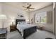 Bedroom with hardwood furnishings, a comfortable bed, and a bright window view at 14007 E Lupine Ave, Scottsdale, AZ 85259