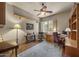 Inviting home office with wood floors, a comfortable chair, and ample natural light at 14007 E Lupine Ave, Scottsdale, AZ 85259