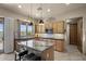 Well-lit kitchen boasting granite countertops, stainless steel appliances, and an island with seating at 14007 E Lupine Ave, Scottsdale, AZ 85259