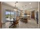 Charming kitchen with custom cabinets, island with seating, and access to an outdoor patio at 14007 E Lupine Ave, Scottsdale, AZ 85259