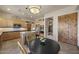 Well-equipped kitchen with stainless steel appliances, wooden cabinets, and island with bar stool seating at 14007 E Lupine Ave, Scottsdale, AZ 85259
