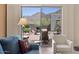 Relaxing living room featuring comfortable seating and serene views of the outdoor patio at 14007 E Lupine Ave, Scottsdale, AZ 85259