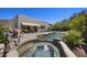 Backyard features a hot tub, water feature, and serene patio seating area at 14007 E Lupine Ave, Scottsdale, AZ 85259