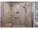 Tiled shower features built-in seating, a rain shower head, and glass-block window at 14007 E Lupine Ave, Scottsdale, AZ 85259