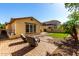 The backyard patio with synthetic grass and desert landscaping at 15456 W Corrine Dr, Surprise, AZ 85379