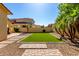 Artificial grass lawn, desert landscaping, with block wall at 15456 W Corrine Dr, Surprise, AZ 85379