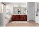 This bathroom features a double sink vanity with ample storage, and a separate tub at 15456 W Corrine Dr, Surprise, AZ 85379