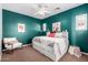 Cozy bedroom with teal walls, white furniture, and plush bedding, creating a relaxing retreat at 15456 W Corrine Dr, Surprise, AZ 85379