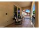 Inviting covered porch with comfortable seating, creating a relaxing outdoor space at 15456 W Corrine Dr, Surprise, AZ 85379