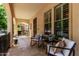 Welcoming front porch with cozy seating, offering an inviting entry to the home at 15456 W Corrine Dr, Surprise, AZ 85379