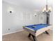 Inviting game room with a pool table, neutral walls, and sconce lighting at 15456 W Corrine Dr, Surprise, AZ 85379