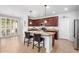 Spacious kitchen features a large island, stainless steel appliances, and rich wood cabinetry at 15456 W Corrine Dr, Surprise, AZ 85379
