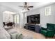 Bright living room with media center, comfortable seating, and dining area in view at 15456 W Corrine Dr, Surprise, AZ 85379