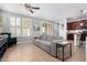 Cozy living room with comfortable seating, natural light, and view into the kitchen at 15456 W Corrine Dr, Surprise, AZ 85379