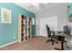 Functional home office featuring a bookcase and a computer desk, perfect for work or study at 15456 W Corrine Dr, Surprise, AZ 85379