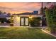 Exterior view of the detached back house, showcasing well-maintained landscaping at 1625 N 11Th Ave, Phoenix, AZ 85007