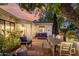 Outdoor patio area featuring a dining set, lounge seating, and a brick-paved floor perfect for entertaining at 1625 N 11Th Ave, Phoenix, AZ 85007
