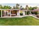 Outdoor patio area with cozy seating, lush greenery, and ambient string lights for evening enjoyment at 1625 N 11Th Ave, Phoenix, AZ 85007