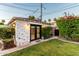Charming guest house with brick accents, lush landscaping, and well-maintained lawn at 1625 N 11Th Ave, Phoenix, AZ 85007
