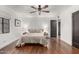 Spacious bedroom featuring hardwood floors, a ceiling fan, and a comfortable queen-sized bed at 1625 N 11Th Ave, Phoenix, AZ 85007