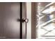 Close-up of a black painted door featuring a decorative crystal-style door knob at 1625 N 11Th Ave, Phoenix, AZ 85007
