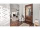 Inviting foyer featuring a stained glass door, hardwood floors, and an open view to the living room at 1625 N 11Th Ave, Phoenix, AZ 85007