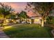 An inviting single-story home with a well-manicured lawn and trees that add beauty and shade at 1625 N 11Th Ave, Phoenix, AZ 85007
