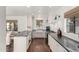 Bright kitchen features white cabinets, dark stone countertops, and hardwood flooring at 1625 N 11Th Ave, Phoenix, AZ 85007