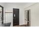 Bright kitchen features a stainless steel refrigerator and dark painted door at 1625 N 11Th Ave, Phoenix, AZ 85007
