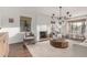 Bright living room with neutral tones, a fireplace, large windows, and modern furnishings for comfortable living at 1625 N 11Th Ave, Phoenix, AZ 85007