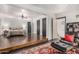 Stunning main bedroom featuring sleek dark-stained hardwood floors and a cozy seating area at 1625 N 11Th Ave, Phoenix, AZ 85007